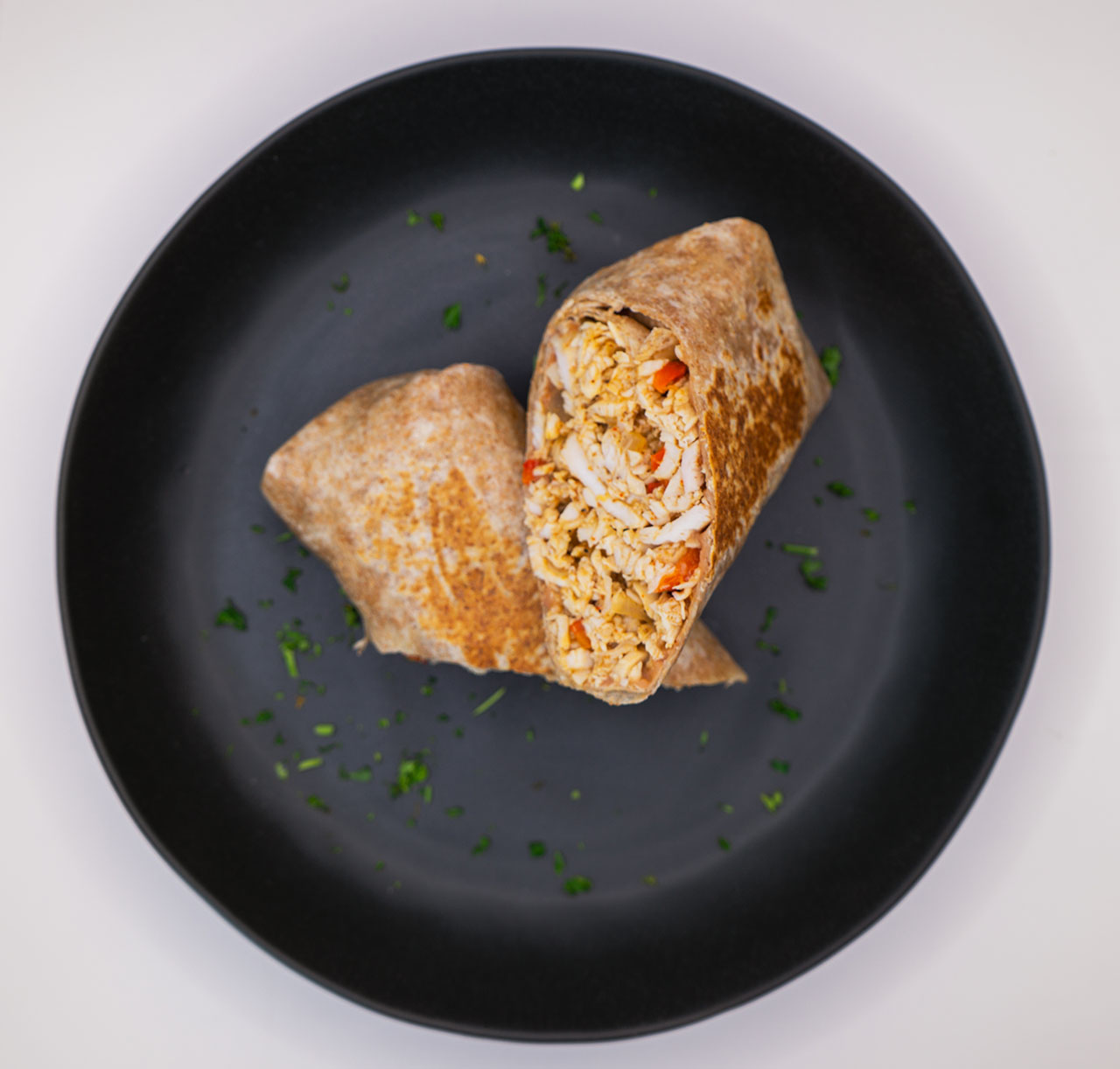 Chicken fajita burrito plated